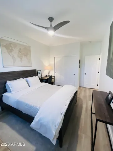 a bedroom with a bed and window