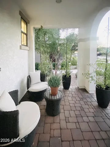 a view of a dining room with furniture and chandelier