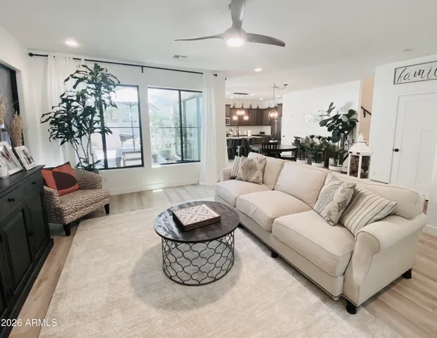 a living room with furniture and a large window