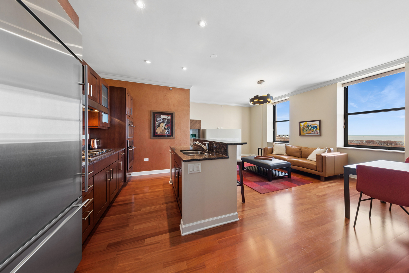 310 South Michigan Avenue, Unit 1001 Chicago, IL 60604 - Photo 12 of 40 a living room with furniture and a wooden floor