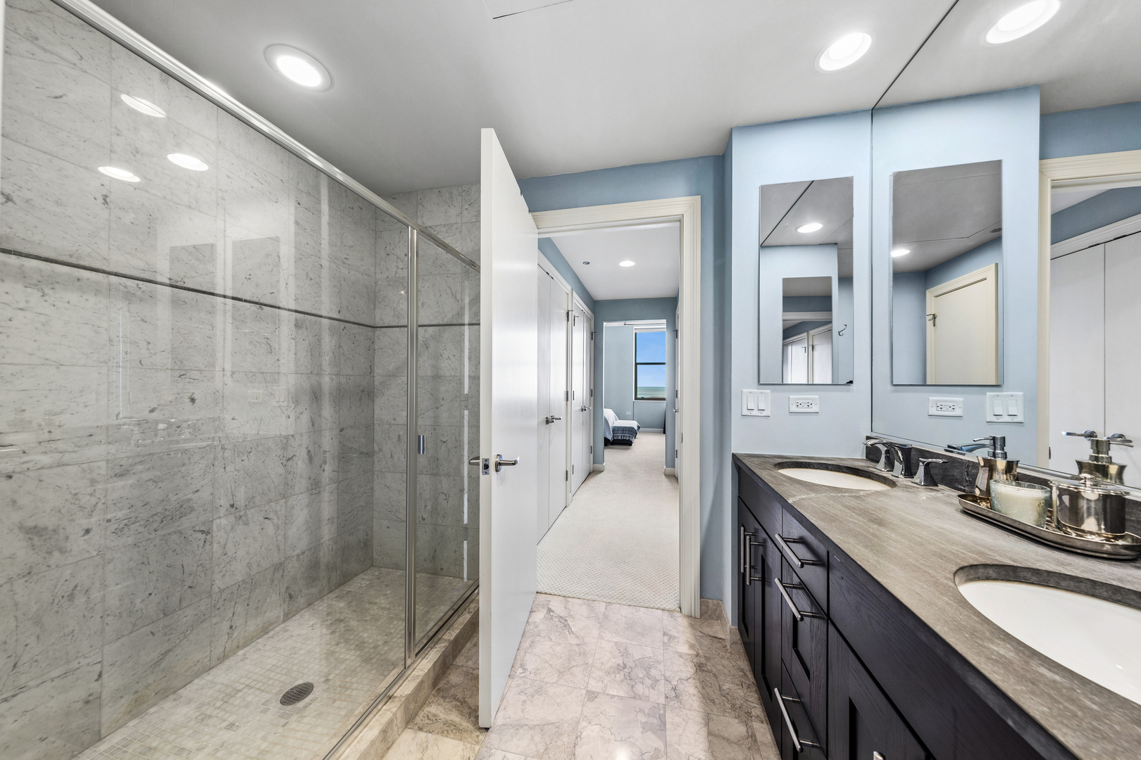 310 South Michigan Avenue, Unit 1001 Chicago, IL 60604 - Photo 15 of 40 a bathroom with a sink and shower