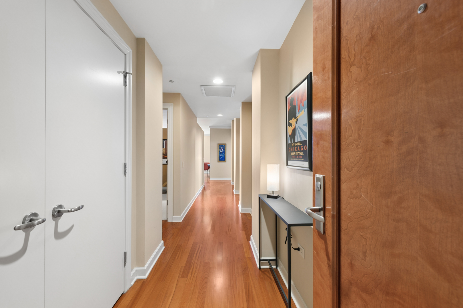 310 South Michigan Avenue, Unit 1001 Chicago, IL 60604 - Photo 2 of 40 a view of a hallway with wooden floor and staircase