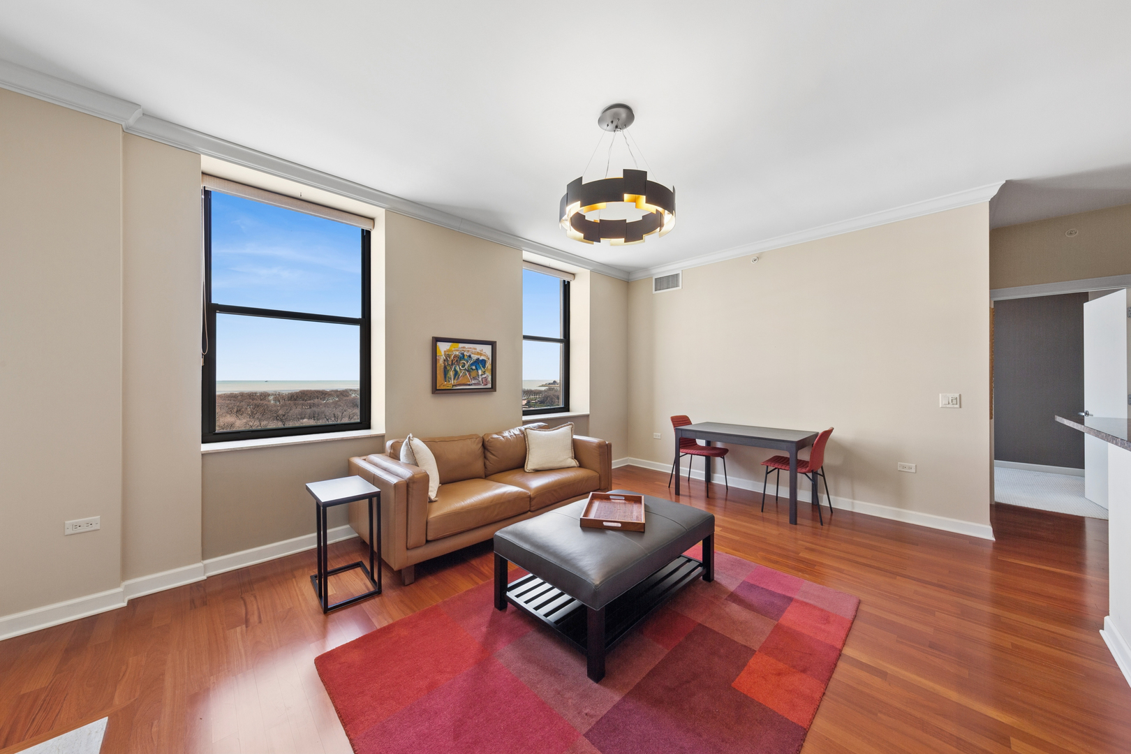 310 South Michigan Avenue, Unit 1001 Chicago, IL 60604 - Photo 4 of 40 a living room with furniture and a wooden floor