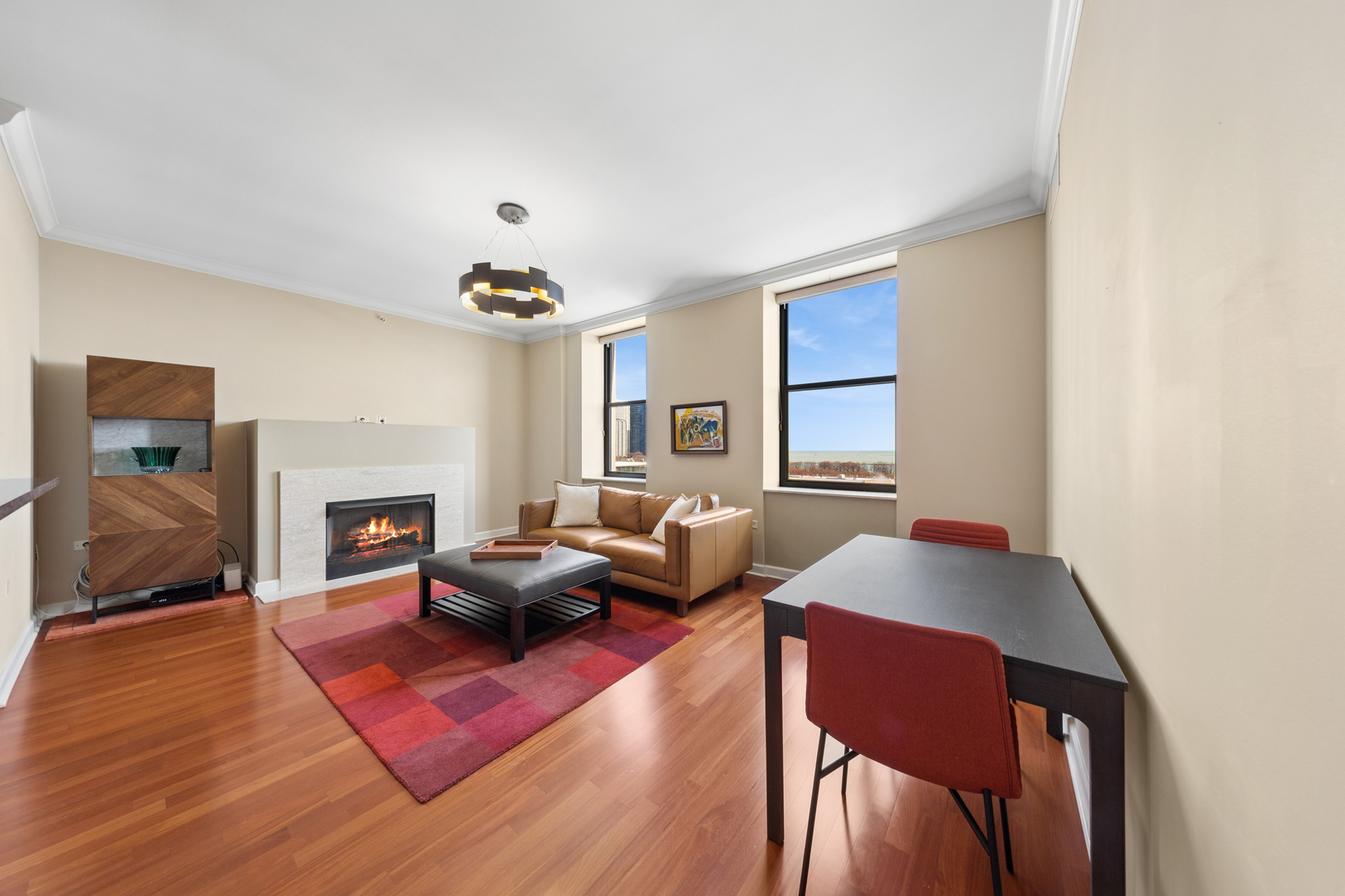 310 South Michigan Avenue, Unit 1001 Chicago, IL 60604 - Photo 5 of 40 a living room with furniture and a fireplace