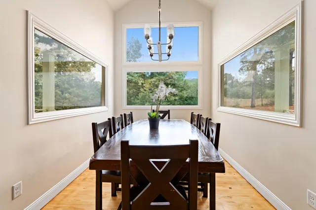 a view of a dining room with furniture window and outside view
