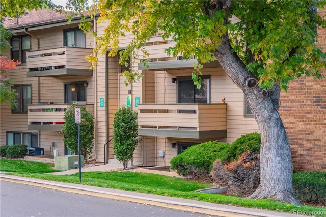 a view of a house with a yard and plants