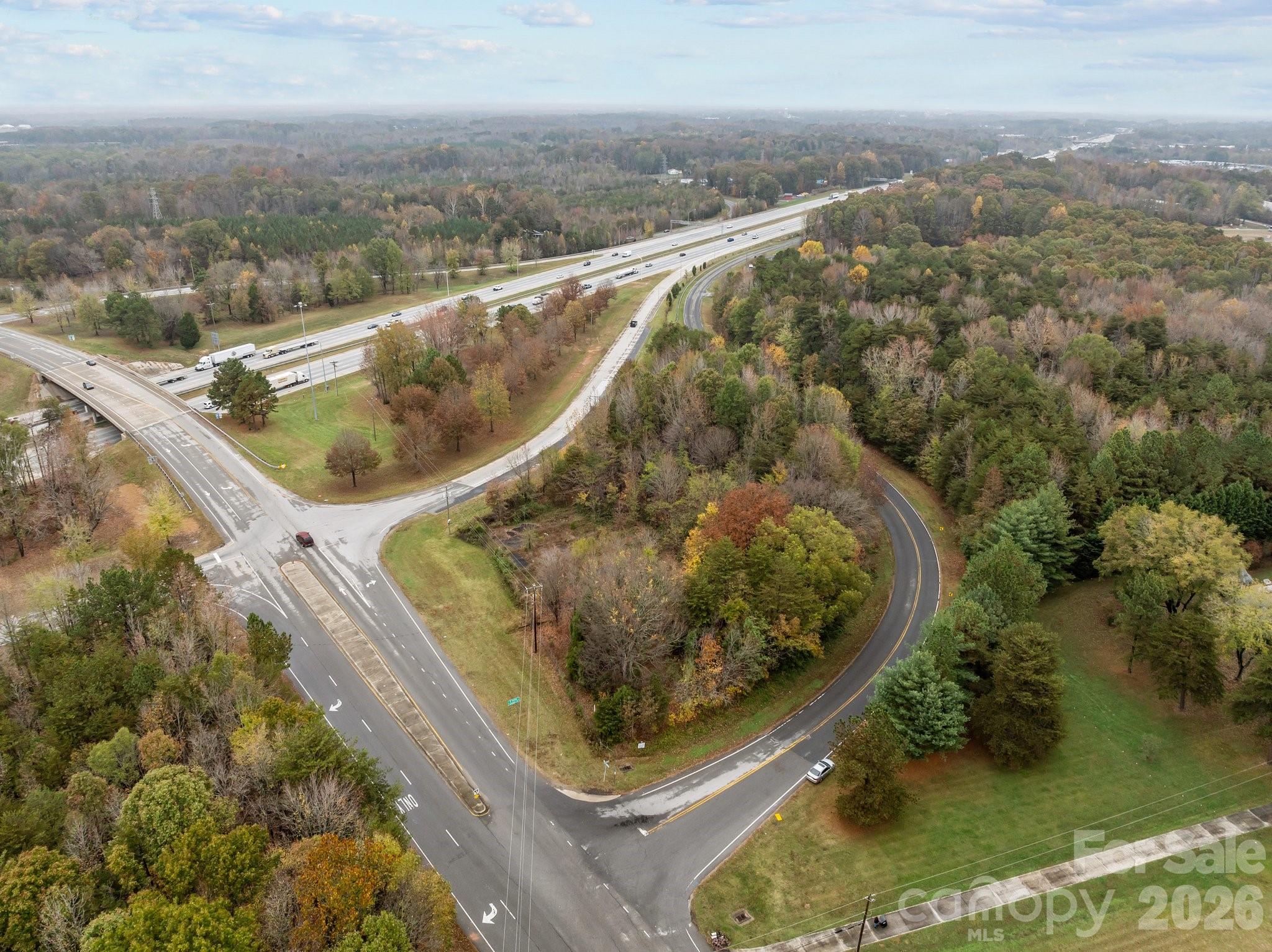 1100 Peach Orchard Road Salisbury, NC 28146 - Photo 2 of 16 an aerial view of a house with a yard and lake view