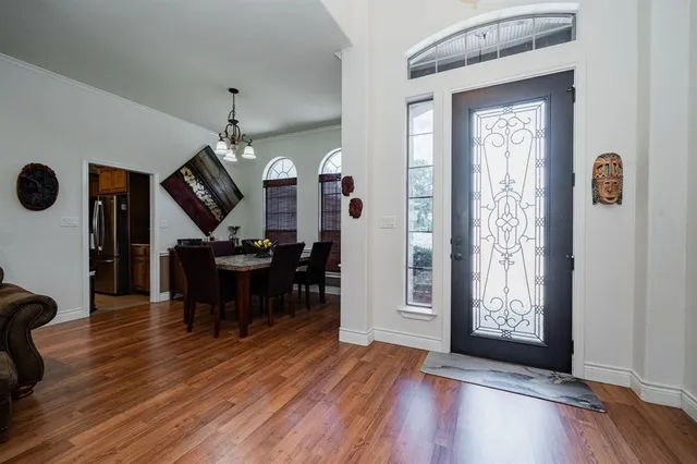 a view of a livingroom with furniture and wooden floor