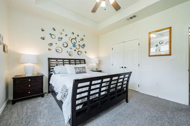 a bedroom with a bed and a bathroom