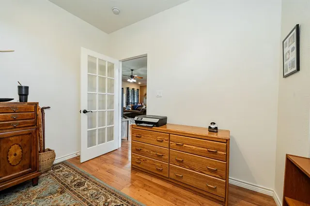 a view of room with furniture and wooden floor