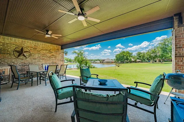 a view of swimming pool with outdoor seating