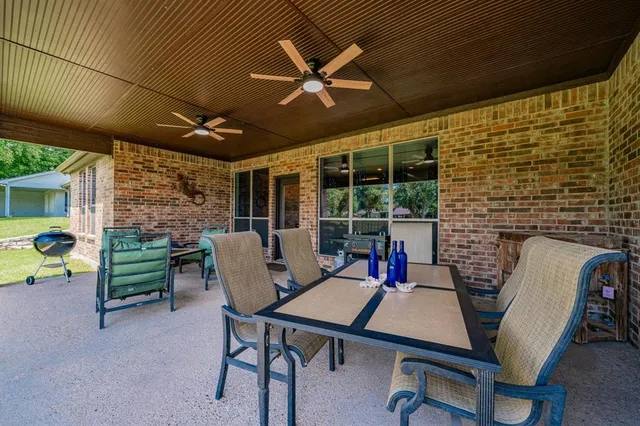 a view of a patio with a table and a chairs