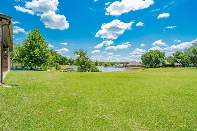 a view of a building with an outdoor space and seating