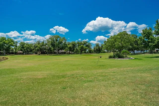 a view of a building with a big yard