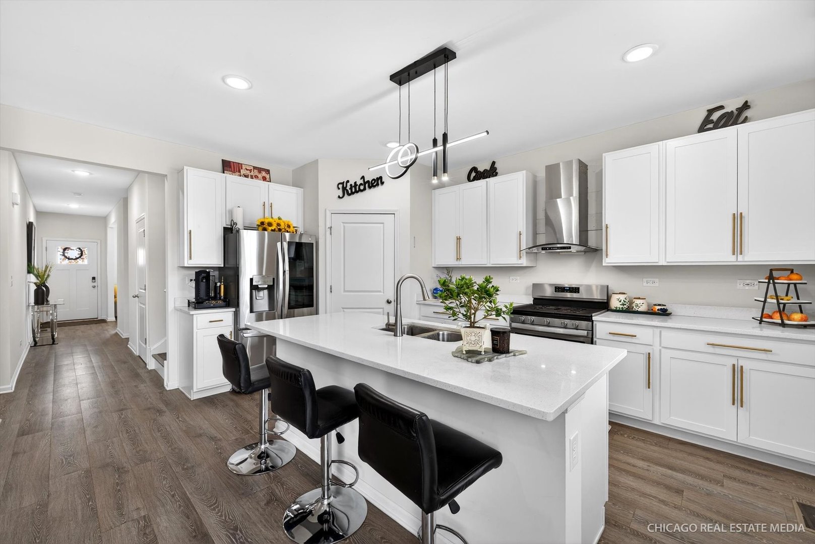 1571 Middleton Road Pingree Grove, IL 60140 - Photo 7 of 35 a kitchen with white cabinets and stainless steel appliances
