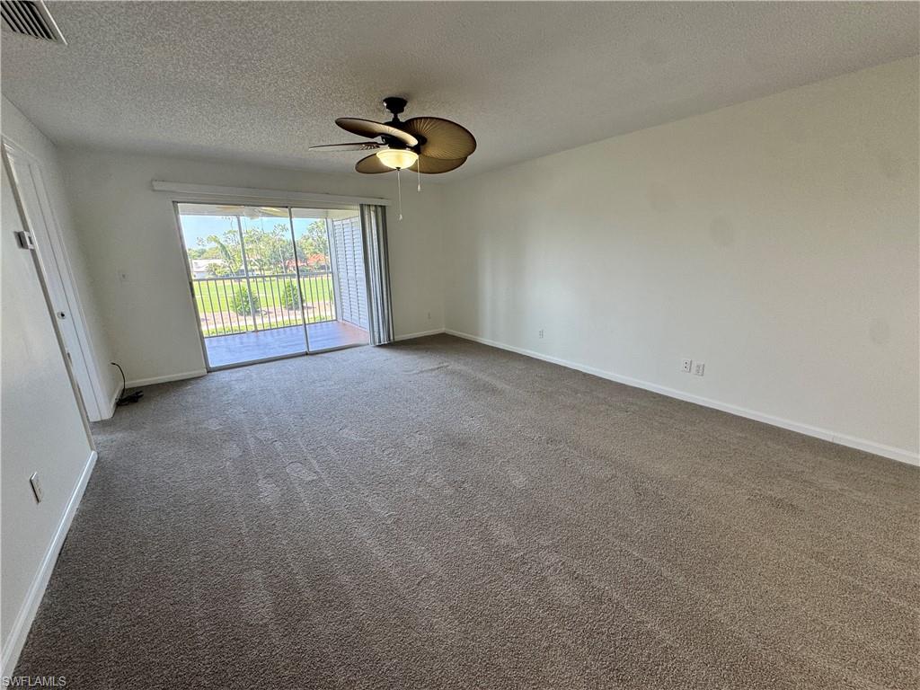 5667 Rattlesnake Hamm Road North, Unit B301 Naples, FL 34113 - Photo 2 of 17 a view of an empty room with a window