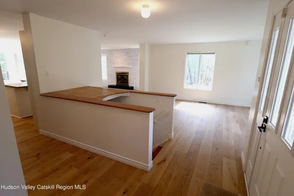 a room with wooden floor and window