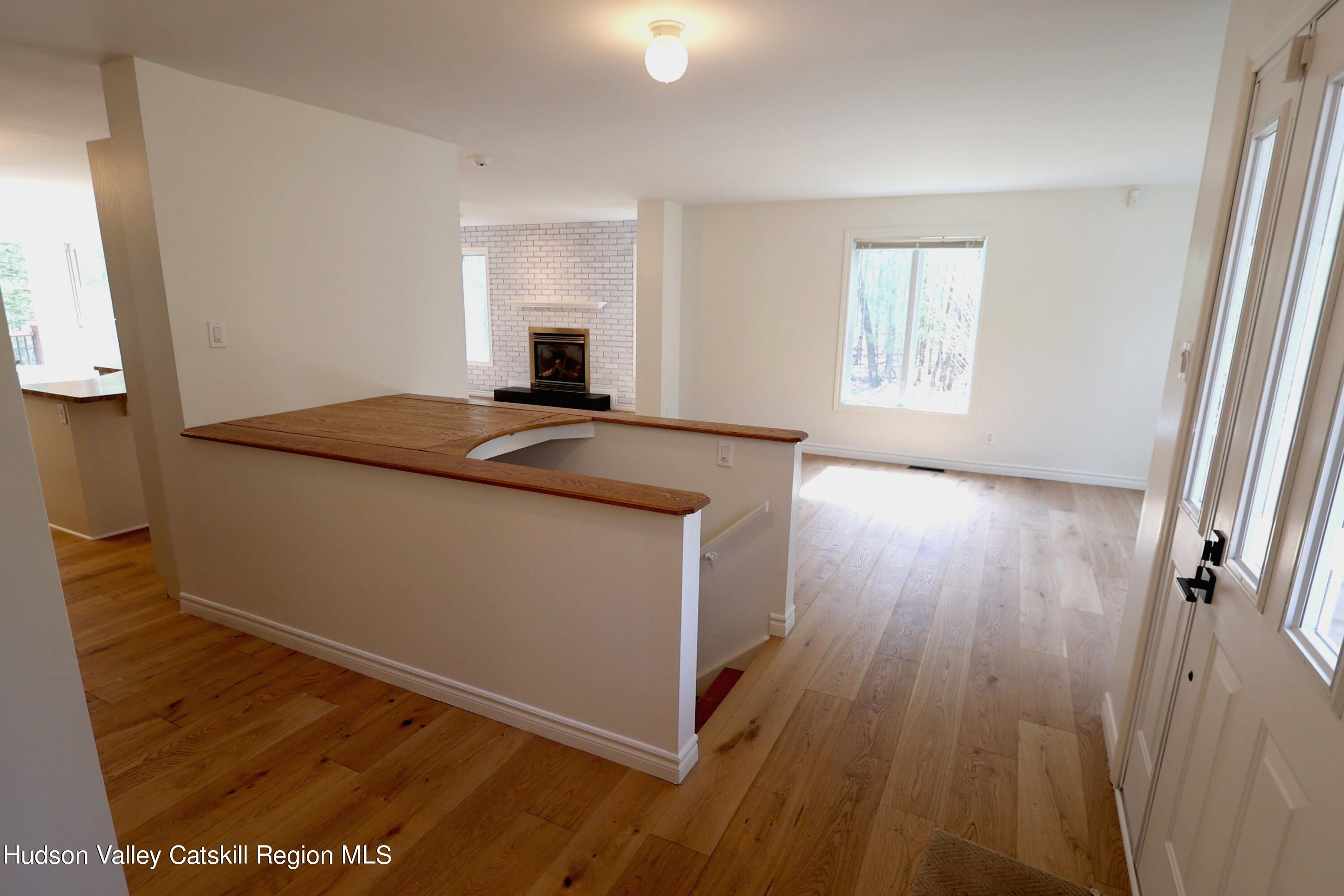 63 Lawrence Hill Road Accord, NY 12404 - Photo 15 of 27 a room with wooden floor and window