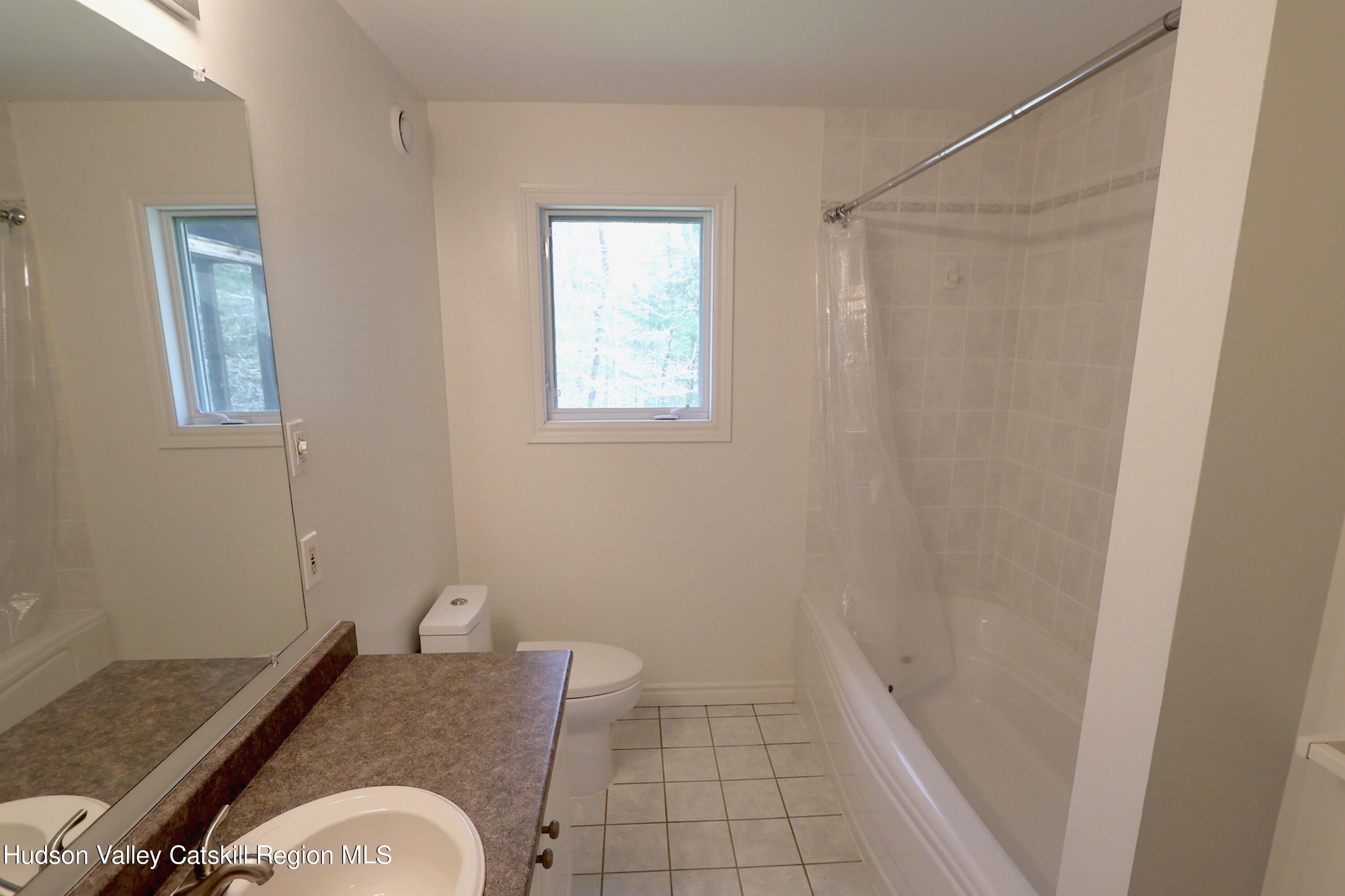 63 Lawrence Hill Road Accord, NY 12404 - Photo 23 of 27 a bathroom with a sink and a mirror