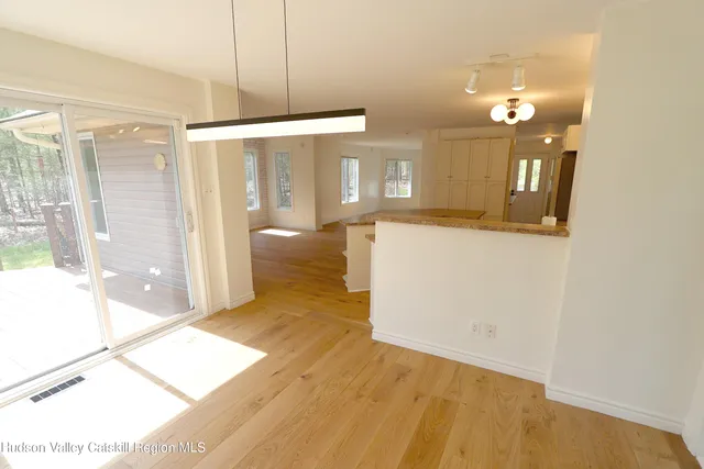 a view of a bathroom with a tub and shower