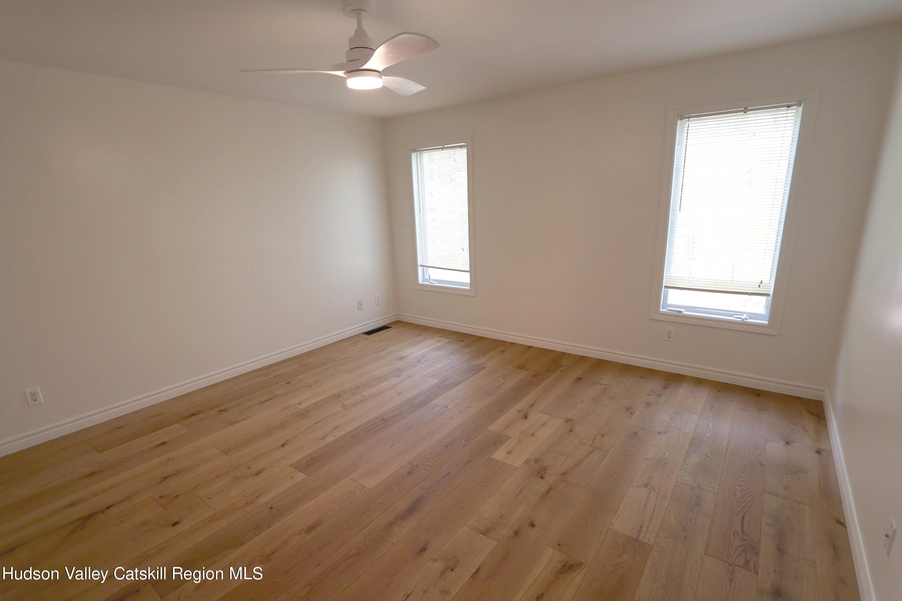 63 Lawrence Hill Road Accord, NY 12404 - Photo 25 of 27 wooden floor in an empty room with a window
