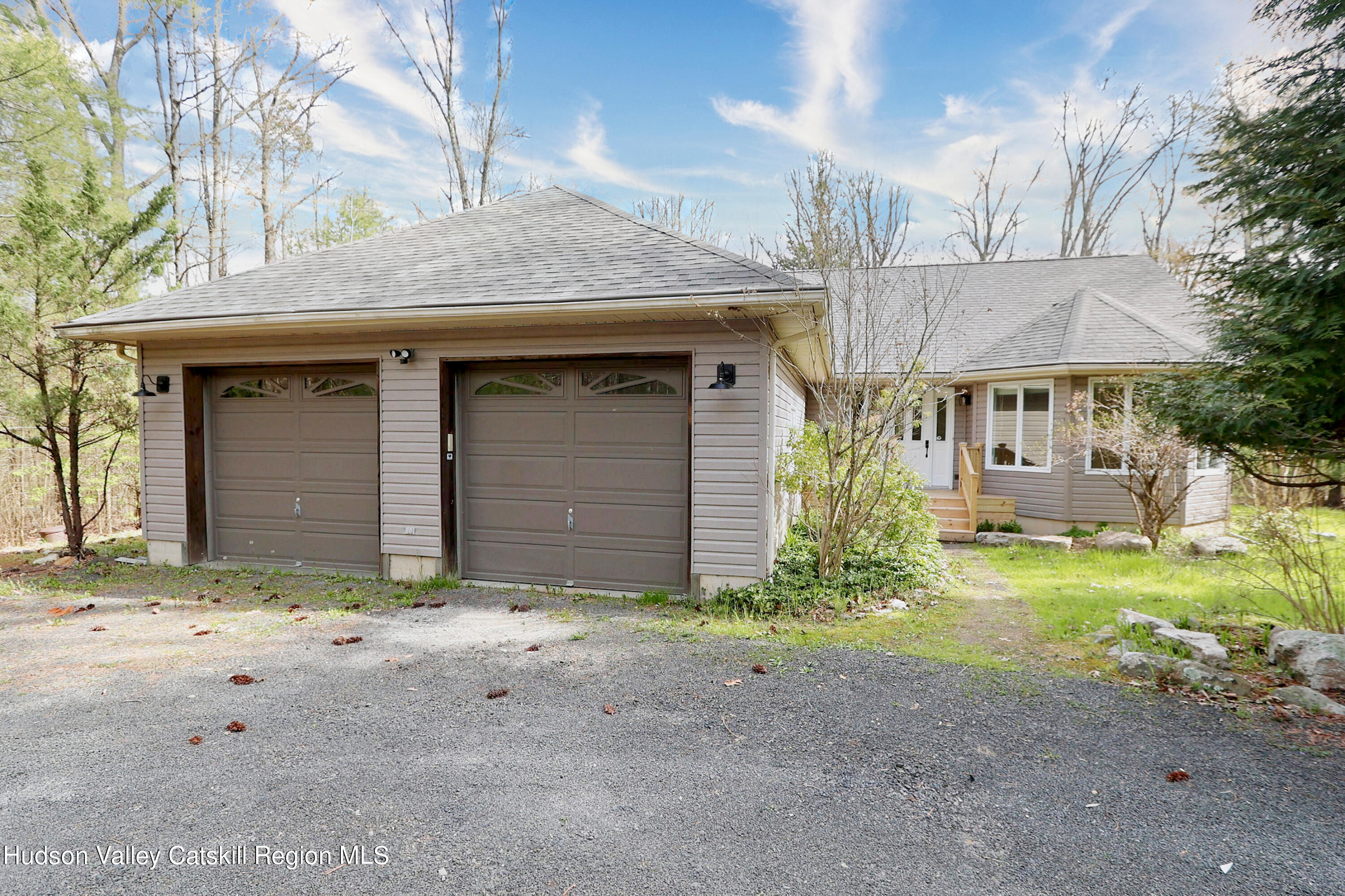 63 Lawrence Hill Road Accord, NY 12404 - Photo 3 of 27 a view of a house with a yard and garage