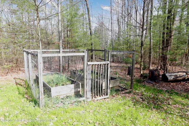 a view of a chair and table in the garden