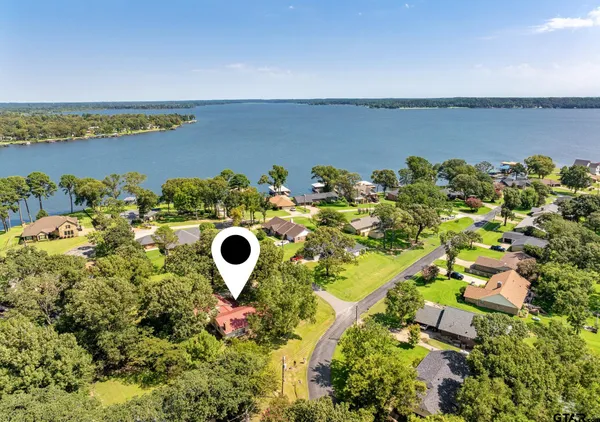 a view of a lake with a building in the background