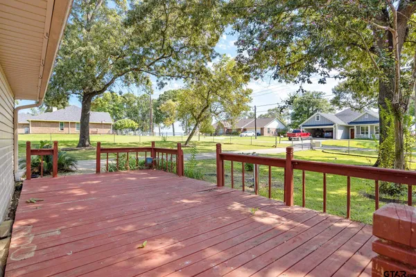 a view of a porch with wooden floor and stairs