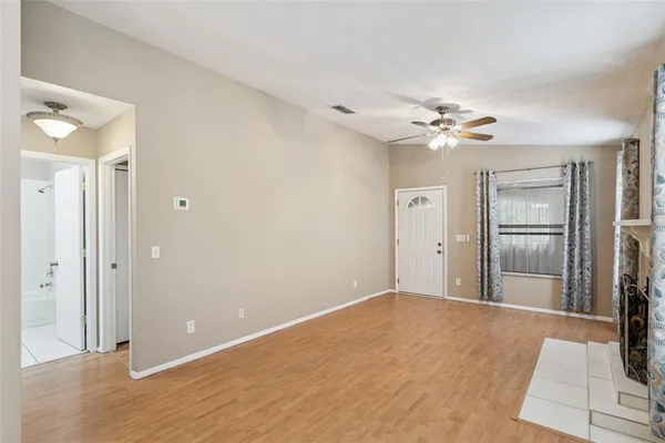 a view of an empty room with a bathroom