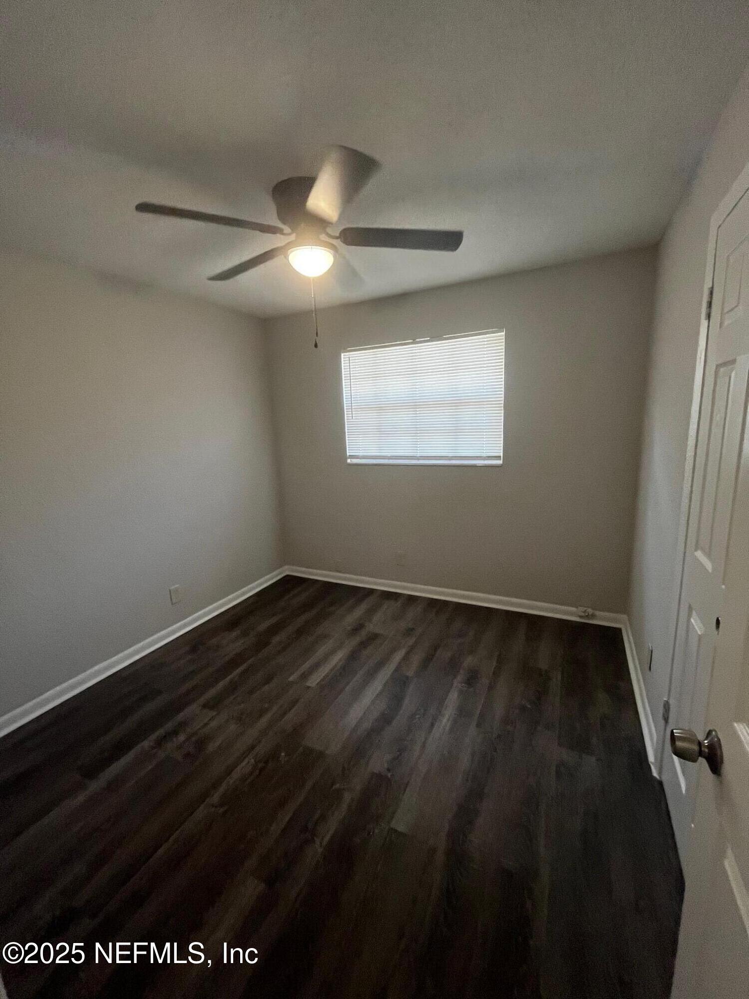 3970 Winton Drive Jacksonville, FL 32208 - Photo 4 of 5 a view of an empty room and window