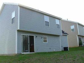 3053 Rockingham Lane Southwest Concord, NC 28025 - Photo 2 of 2 a view of a house with a yard