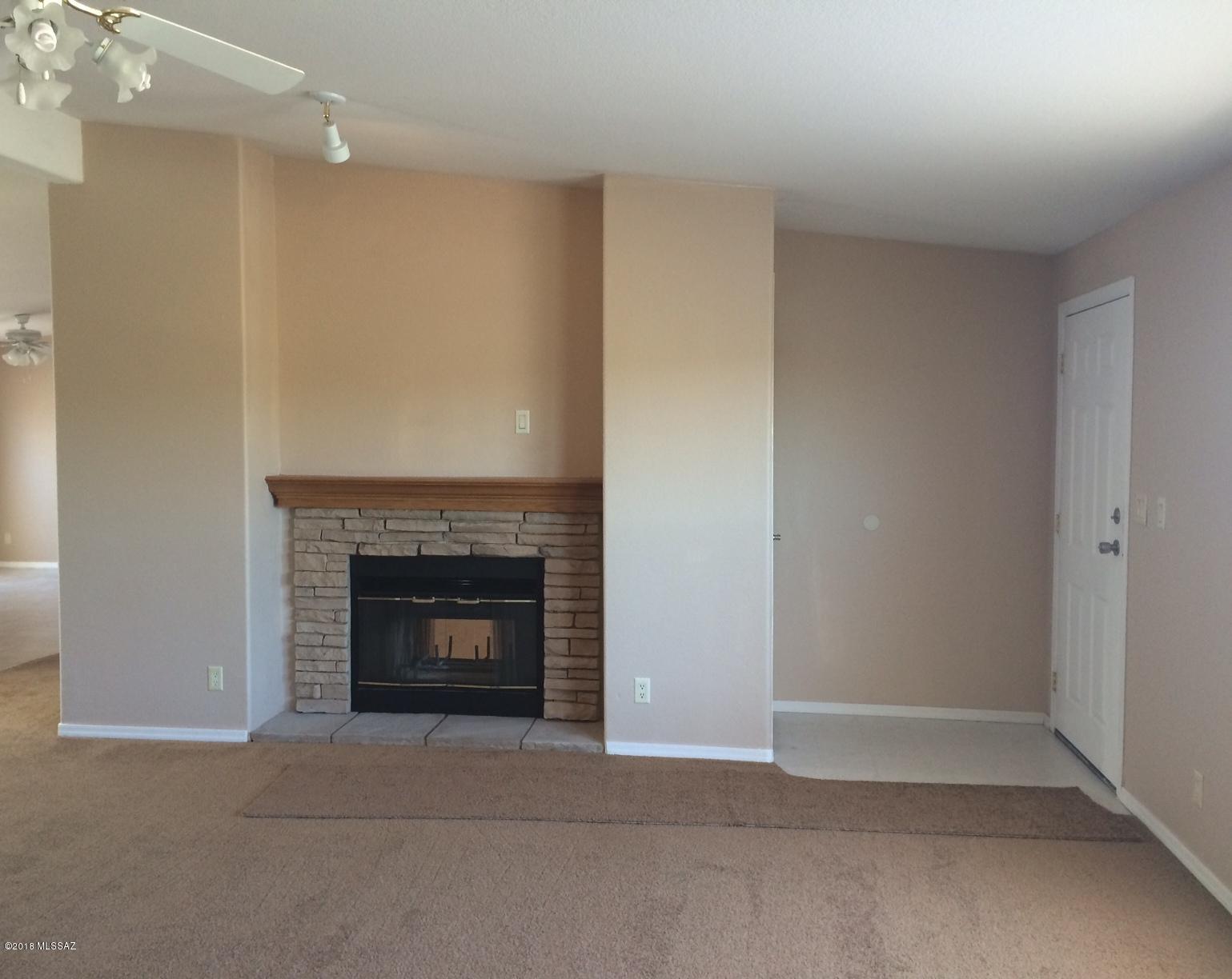 15146 North Ironwood Tree Road Tucson, AZ 85739 - Photo 5 of 9 a room with a fireplace