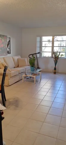 a living room with a couch and a table