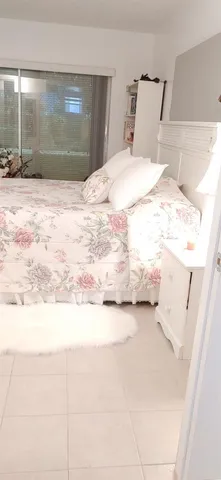 a large white bed in a white room