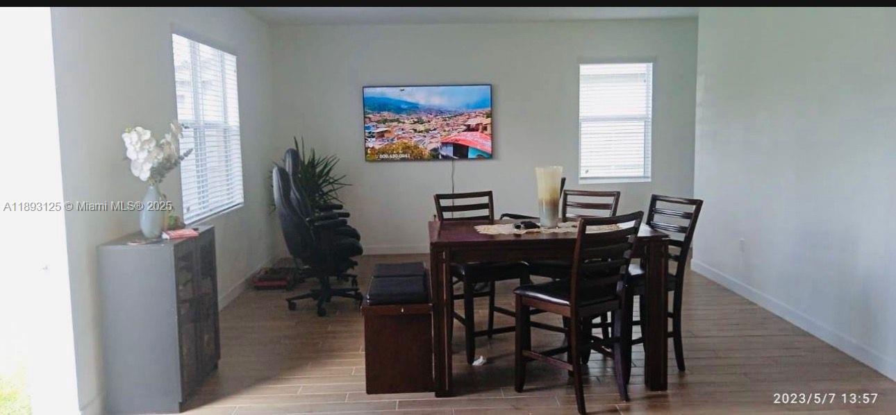 13219 Southwest 270th Terrace Homestead, FL 33032 - Photo 4 of 11 a view of a dining room with furniture