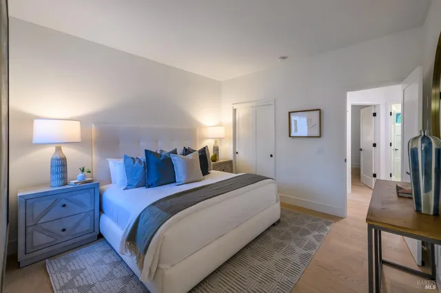 a bed room with a bed and a lamp