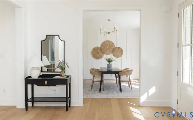 a view of dining room with furniture and wooden floor