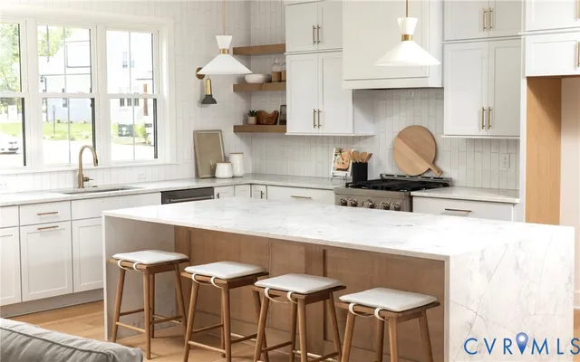 a kitchen with stainless steel appliances a sink and a stove