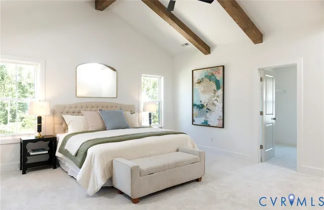 a bedroom with a bed and a painting on the wall