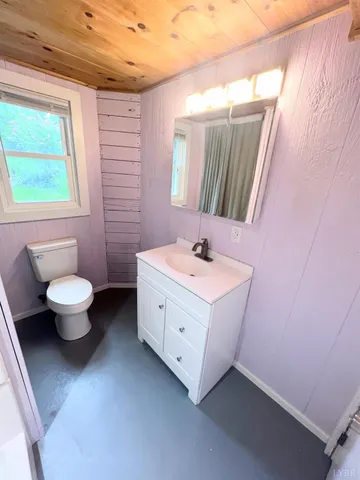 a bathroom with a sink vanity and a mirror
