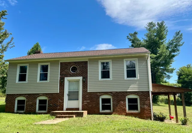 a front view of a house with yard