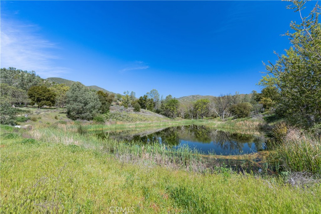 0 Av Ranch Road Greenfield, CA 93927 - Photo 2 of 26 a view of a lake from a yard