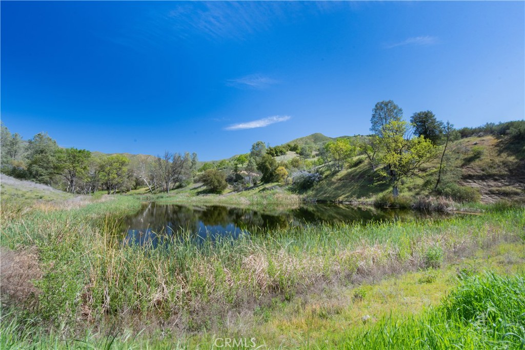 0 Av Ranch Road Greenfield, CA 93927 - Photo 4 of 26 a view of a lake with a yard