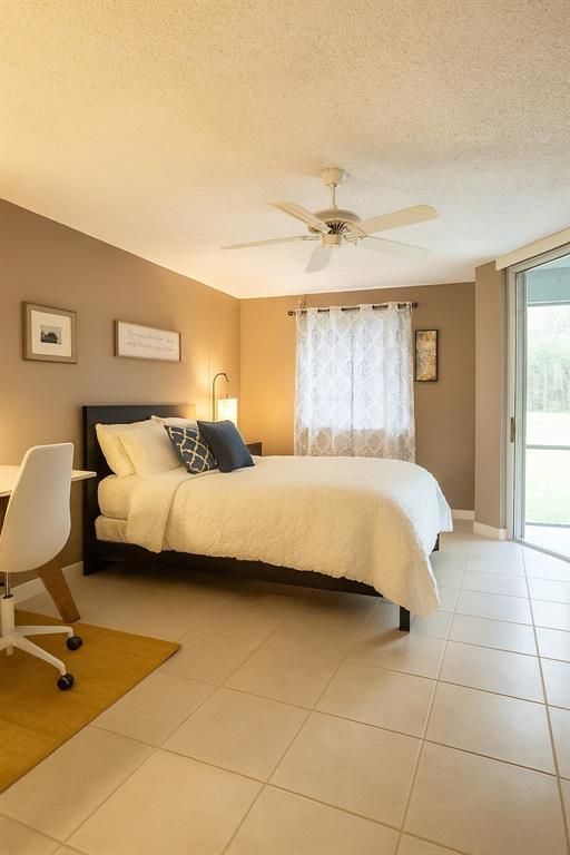 9778 Nickels Boulevard, Unit 504 Boynton Beach, FL 33436 - Photo 11 of 31 a bedroom with a bed chair and window