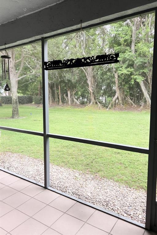 9778 Nickels Boulevard, Unit 504 Boynton Beach, FL 33436 - Photo 16 of 31 a view of a lake and a yard from a window