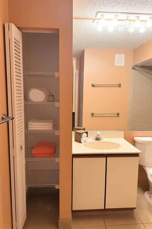 9778 Nickels Boulevard, Unit 504 Boynton Beach, FL 33436 - Photo 17 of 31 a en suite bathroom with a sink and a mirror