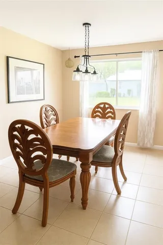 a view of a dining room with furniture and window