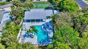 9778 Nickels Boulevard, Unit 504 Boynton Beach, FL 33436 - Photo 28 of 31 an aerial view of a house with a yard and garden