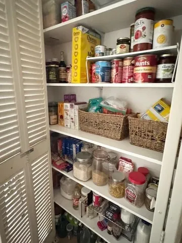 a shelf with cup and plates